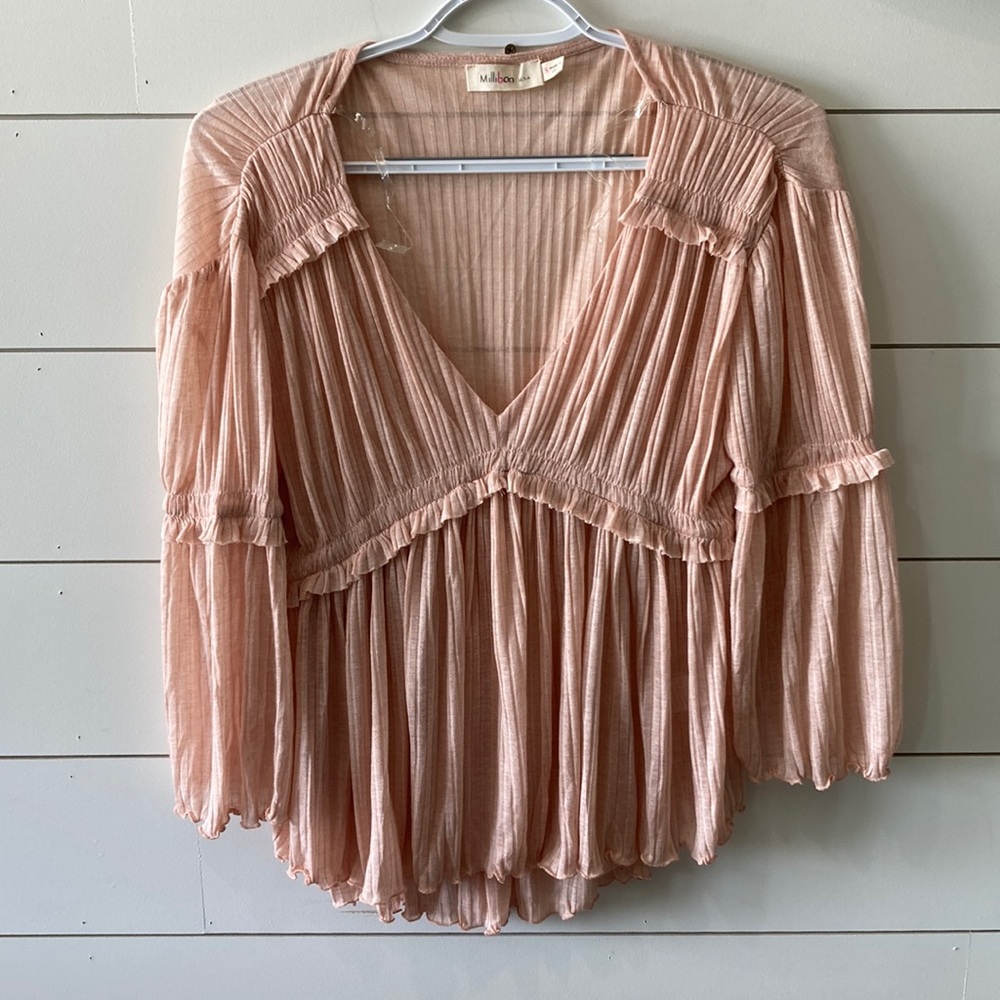 MILLIBON. Light pink shirt.